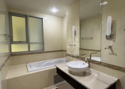 Modern bathroom with bathtub and vanity