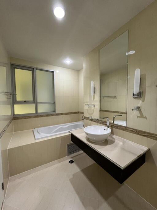 Modern bathroom with bathtub and vanity