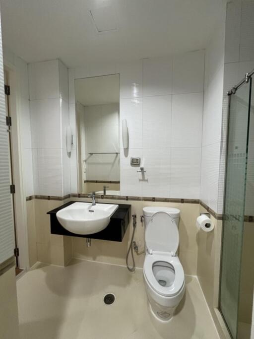 Bathroom with sink, toilet, and shower