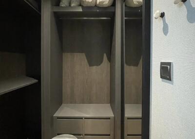 Modern closet with a mirror and small stool