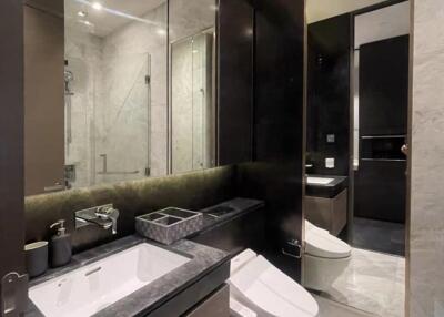 Modern bathroom with large mirror and elegant fixtures