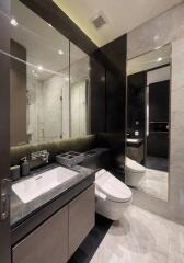 Modern bathroom with large mirror and elegant fixtures