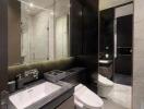 Modern bathroom with large mirror and elegant fixtures