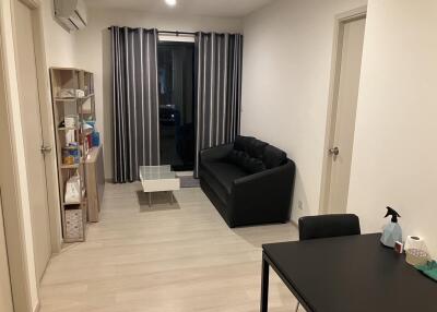 Modern living room with black sofa and table