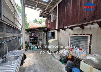 Outdoor area with sink and utility space