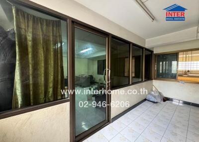 Office space with glass windows and tiled floor