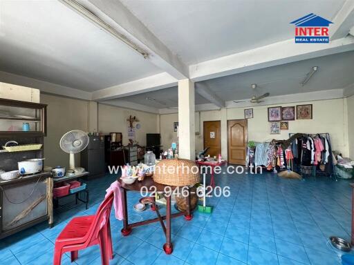 Multipurpose main living area with blue tiled floors and various furnishings