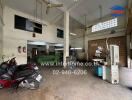 Industrial workshop space with equipment and parked motorbikes