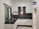 Modern kitchen with tiled backsplash and stainless steel appliances