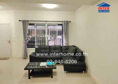 Modern living room with black sofa and coffee table