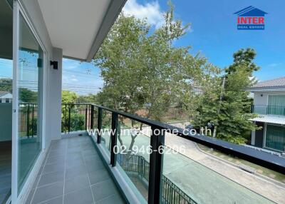 Modern balcony with glass railing and outdoor view