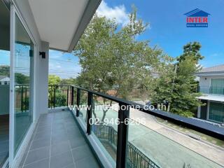 Modern balcony with glass railing and outdoor view