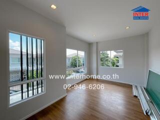 Spacious living room with large windows