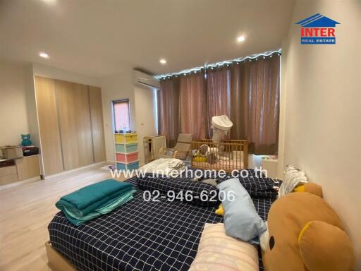 Bedroom with furniture and nursery corner