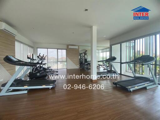 Spacious indoor gym with multiple treadmills and exercise bikes