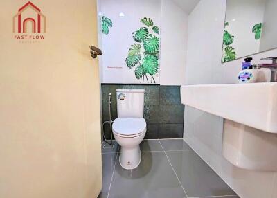 Contemporary bathroom with a modern design and botanical tile accents