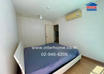 Bedroom with a bed and air conditioning