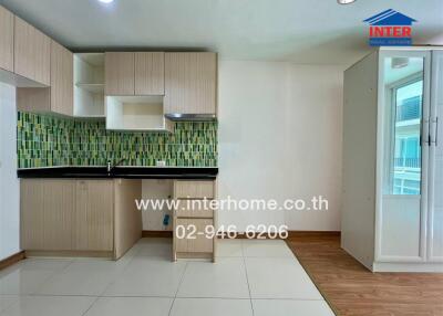 Modern kitchen area with wooden cabinets and green mosaic backsplash