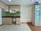 Modern kitchen area with wooden cabinets and green mosaic backsplash