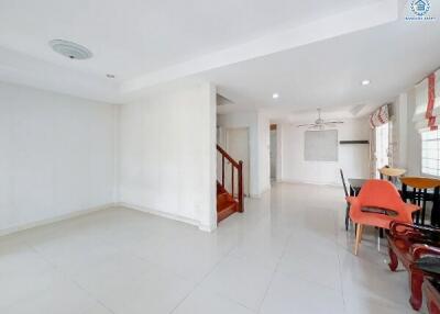 Bright and spacious living area leading to dining space