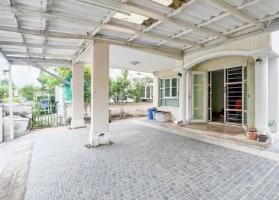 covered carport with tiled flooring