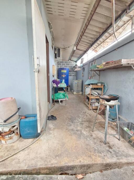 Outdoor utility and storage area with various items