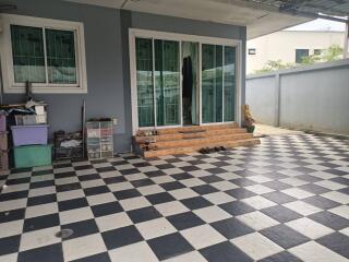 Outdoor patio with checkered flooring