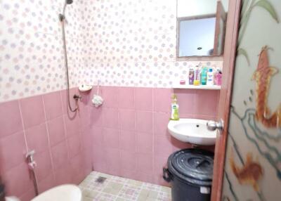 Bathroom with shower, toilet, sink and mirror