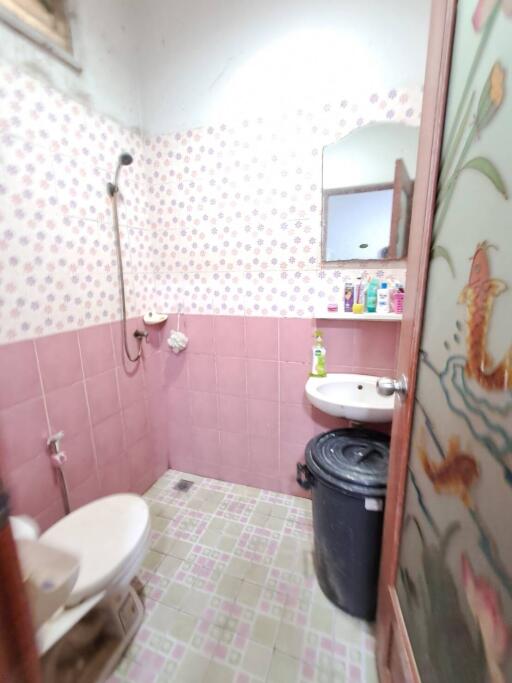 Bathroom with shower, toilet, sink and mirror