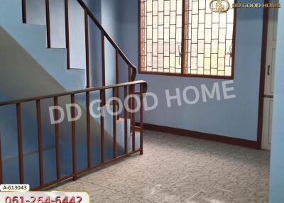 Indoor staircase with blue walls and decorative railing