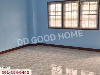 Empty bedroom with tiled floor and large windows