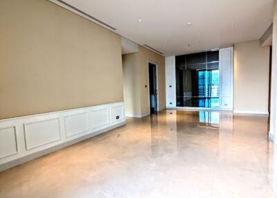 Spacious living room with marble flooring and large windows