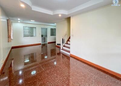 spacious living room with staircase