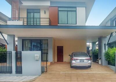 Modern two-story house with a car in the driveway