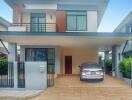 Modern two-story house with a car in the driveway