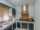 Modern kitchen with dark wood cabinets and mosaic tile backsplash