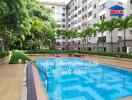 Outdoor swimming pool area in a residential building complex