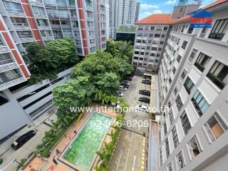 Apartment complex exterior view with pool