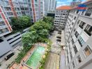 Apartment complex exterior view with pool