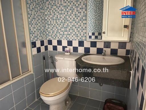 Modern bathroom with blue and white tile design