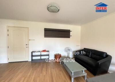 Living room with wooden flooring and modern furniture