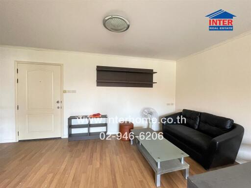 Living room with wooden flooring and modern furniture