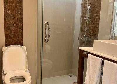 Modern bathroom with glass shower and toilet