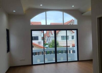 Spacious living room with large windows