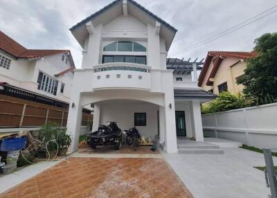 Exterior front view of a two-story house with a garage