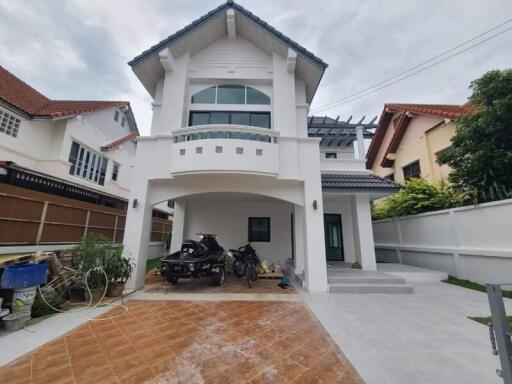 Exterior front view of a two-story house with a garage