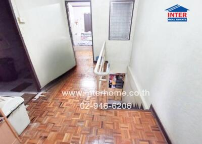 Staircase and hallway with polished wooden floor