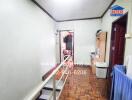 Hallway with parquet flooring and adjacent rooms