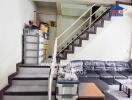 Living room with a staircase and furniture