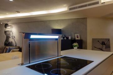 Modern kitchen with induction cooktop and sleek design